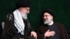 İran'ın dini lideri Ali Hamaney (solda) ve İran Cumhurbaşkanı Reisi (sağda).