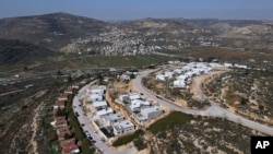  مغربی کنارے میں تعمیر شدہ ایک یہودی بستی کا منظر ،فوٹو اے پی ، 14 فروری 2024